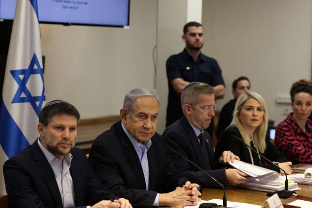  Israeli Prime Minister Benjamin Netanyahu convenes the weekly cabinet meeting at the Defence Ministry in Tel Aviv, Israel, January 7, 2024.  (photo credit:  REUTERS/Ronen Zvulun/Pool)