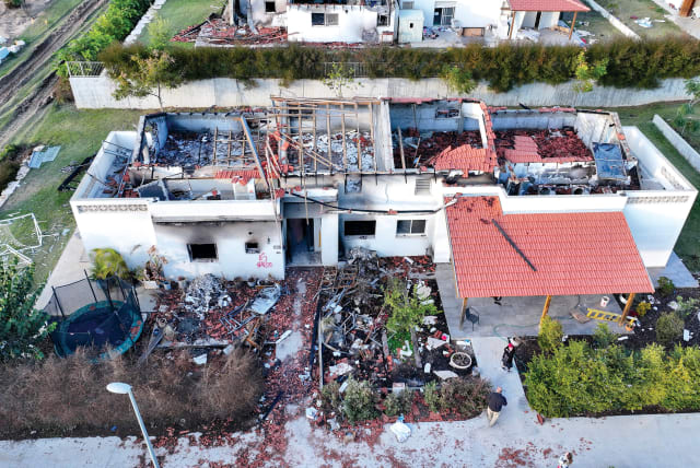  A damaged house is seen, following the deadly October 7 attack, in Kibbutz Be’eri in southern Israel. (photo credit: ILAN ROSENBERG/REUTERS)