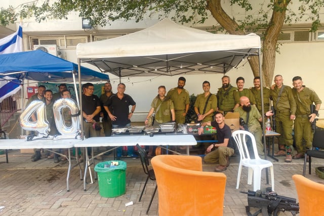  Hungry IDF soldiers welcome a Shabbat meal at their base.  (photo credit: ETHAN KUSHNER)