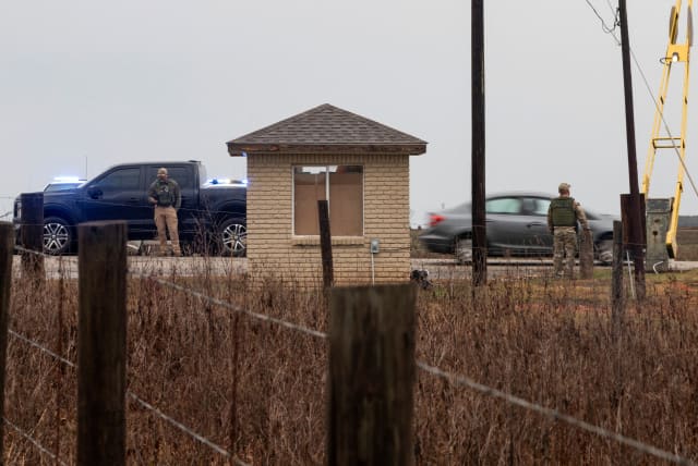  The gate at Holman Correctional Facility is monitored by law enforcement before the scheduled execution by asphyxiation using pure nitrogen of Kenneth Smith who is convicted for a murder-for-hire committed in 1988, in Atmore, Alabama, U.S. January 25, 2024. (photo credit: REUTERS/MICAH GREEN)
