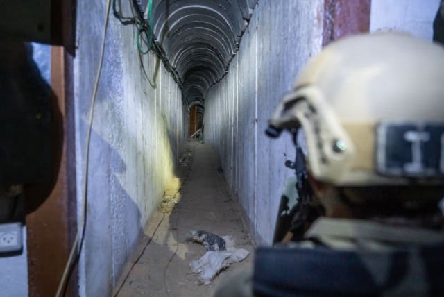  IDF soldiers clear a tunnel in the Gaza Strip (photo credit: IDF SPOKESPERSON'S UNIT)