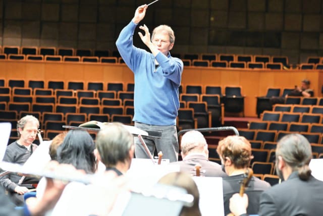  YOEL LEVI at the helm of the Haifa Symphony Orchestra (photo credit: REUVEN COHEN)