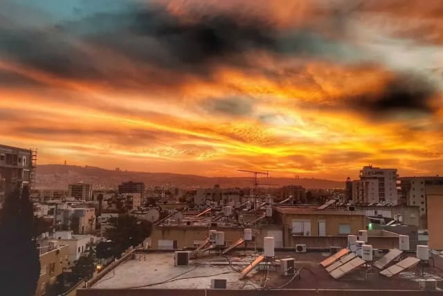  Kiryat Ata sunset March 18, 2018 (photo credit: Amir Goldstein, REUVEN CASTRO)