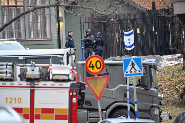  Emergency workers stand near the Israeli embassy in Stockholm, January 31, 2024 (photo credit:  HENRIK MONTGOMERY/TT NEWS AGENCY/VIA REUTERS)
