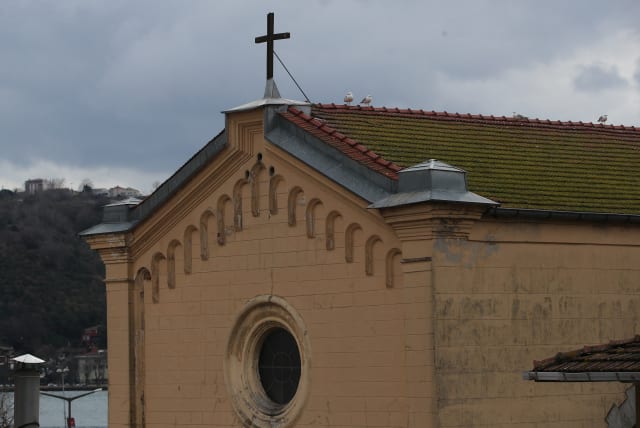  The Italian Santa Maria Catholic Church is pictured after two masked gunmen were shooting during Sunday service, in Istanbul, Turkey January 28, 2024. (photo credit: REUTERS/DILARA SENKAYA)