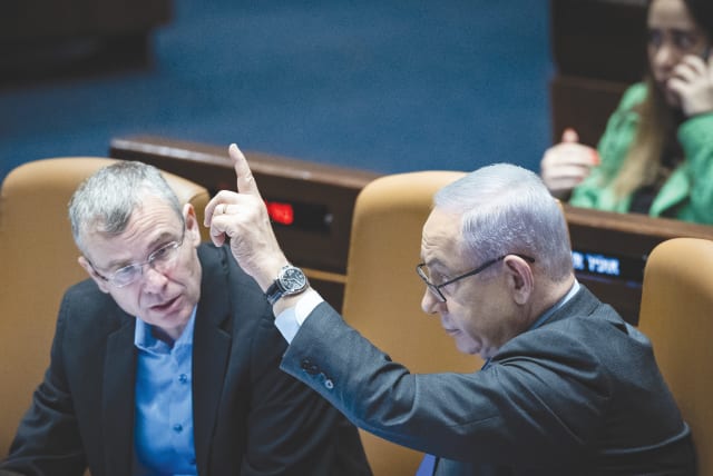  PRIME MINISTER Benjamin Netanyahu and Justice Minister Yariv Levin attend a debate and voting on the state budget bill, in the Knesset plenum, in December.  (photo credit: YONATAN SINDEL/FLASH90)