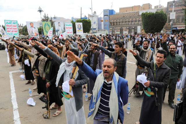  Participants take the oath of allegiance to the Houthi movement during a parade in a show of force amid a standoff in the Red Sea and US-led airstrikes on Houthi targets, in Sanaa, Yemen, February 8, 2024. (photo credit: REUTERS/KHALED ABDULLAH)