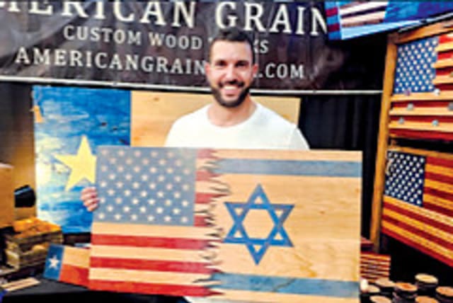  Eshhar Tal holding his American-Israeli flag in Texas.  (photo credit: JOSEPH SCUTTS)