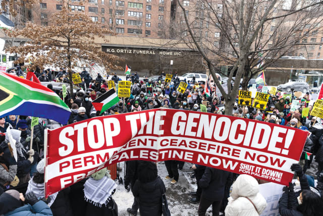  Pro-Palestinian demonstrators protest as they take part in the ‘Biden: Stop supporting genocide!’ rally in New York City on January 20.  (photo credit: JEENAH MOON/REUTERS)