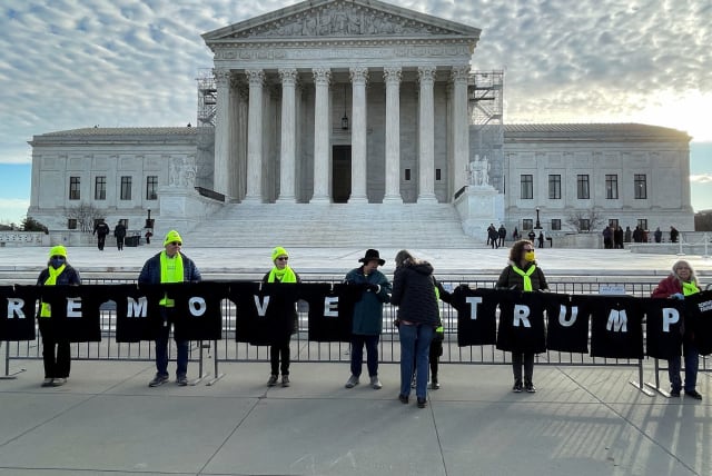  Demonstrators gather outside the U.S. Supreme Court ahead of arguments in former U.S. President Donald Trump's appeal of a lower court's ruling disqualifying him from the Colorado presidential primary ballot, in Washington, U.S., February 8, 2024. (photo credit: REUTERS/Andrew Chung)