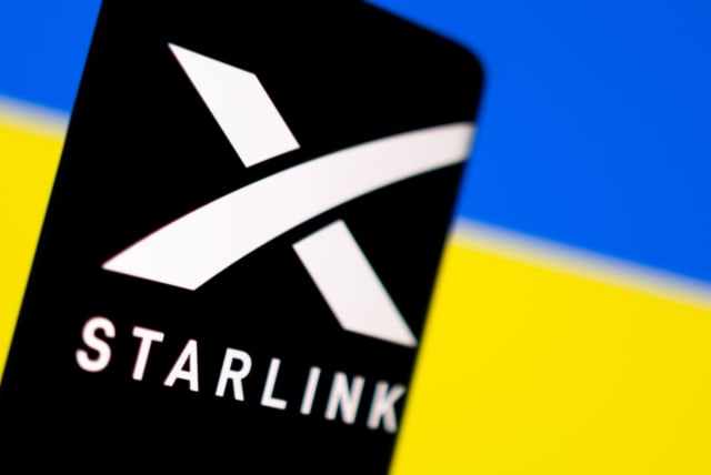  Starlink logo is seen on a smartphone in front of displayed Ukrainian flag in this illustration taken February 27, 2022. (photo credit:  REUTERS/DADO RUVIC/ILLUSTRATION/FILE PHOTO)