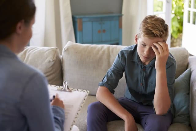 A young teenager undergoing psychological treatment (photo credit: SHUTTERSTOCK)