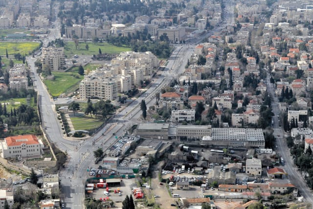  Aerial view of neighborhoods: Hebron Road (C) crosses between the Talpiot and Arnona neighborhoods; Bethlehem Road (R) crosses Baka. (photo credit: FLASH90)