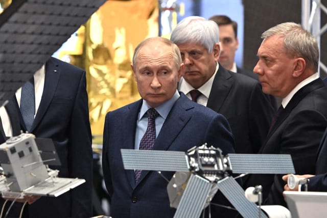  Russia's President Vladimir Putin, accompanied by head of the Roscosmos space corporation Yuri Borisov, visits the centre of the Rocket and Space Corporation "Energia" in Korolyov outside Moscow, Russia, October 26, 2023.  (photo credit:  Sputnik/Sergei Bobylev/Pool via REUTERS )