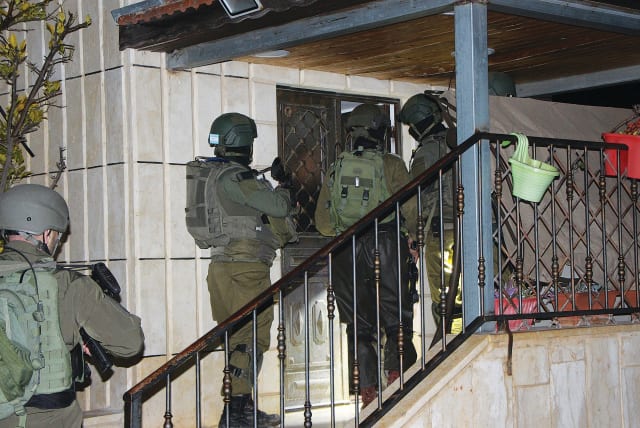  SOLDIERS IN the Etzion Brigade take part in a raid in the Gush Etzion village of Seir al Shuyukh.  (photo credit: JONATHAN SPYER)