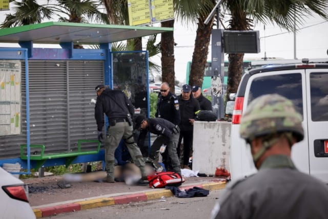  Israeli security seen near a terrorist at the scene of a shooting attack in Southern Israel.  February 16, 2024 (photo credit: NATI SHOHAT/FLASH90)