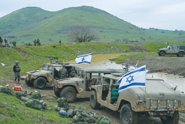 IDF RESERVE soldiers from the Nahal Brigade take part in a military drill on the Golan Heights last week. The State of Israel is the achievement of the early Zionists’ dream of creating a state where the Jewish people can defend themselves. (photo credit: MICHAEL GILADI/FLASH90)