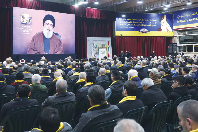  HEZBOLLAH LEADER Sheikh Hassan Nasrallah delivers a video address during a rally in Beirut last week. (photo credit: AZIZ TAHER/REUTERS)