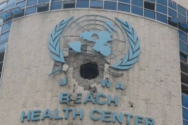  A view of the damaged exterior of a UNRWA health centre, amid the ongoing conflict between Israel and the Palestinian Islamist group Hamas, in Gaza, in this still image taken from video released February 15, 2024.  (photo credit: Handout via Reuters)