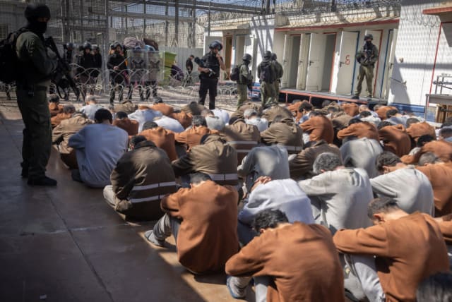  Hamas terrorists who were caught during the October 7 massacre and during the IDF operation in the Gaza Strip, seen at a courtyard in a prison in southern Israel, February 14, 2024 (photo credit: Chaim Goldberg/Flash90)