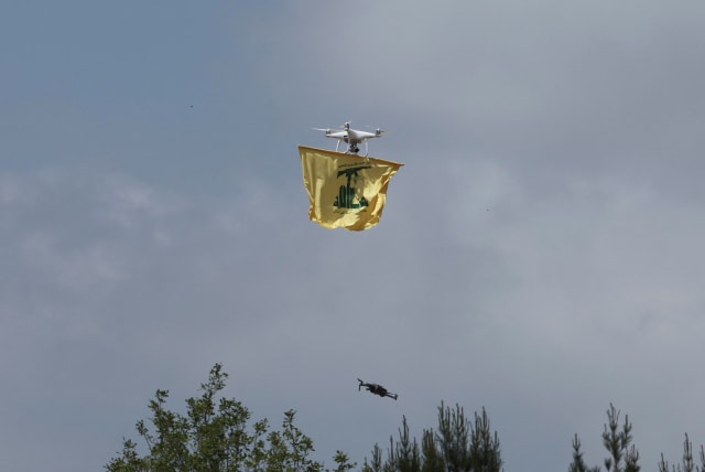  A drone carries a Hezbollah flag, May 21, 2023 (photo credit: REUTERS/AZIZ TAHER)