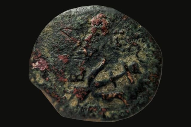  2,000 year old Hasmonean coin found by a kibbutz evacuee, February, 2024 (photo credit: Israel Antiquities Authority)