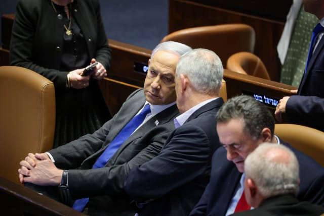Prime Minister Benjamin Netanyahu seen in the Knesset plenum on February 21, 2024 (photo credit: NOAM MOSKOVICH/KNESSET)