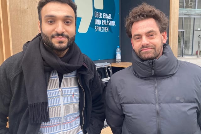 Ahmad Dakhnous, left, and Shai Hoffman together brokered small-group conversations about the Israel-Hamas war outside the Berlinale film festival in Berlin, Feb. 18, 2024 (photo credit: TOBY AXELROD)