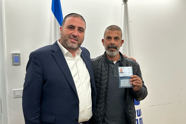  Interior Minister Moshe Arbel granting permanent resident status to Hamid Abu Arar for his life-saving actions on October 7, February 21, 2024. (photo credit: Courtesy)