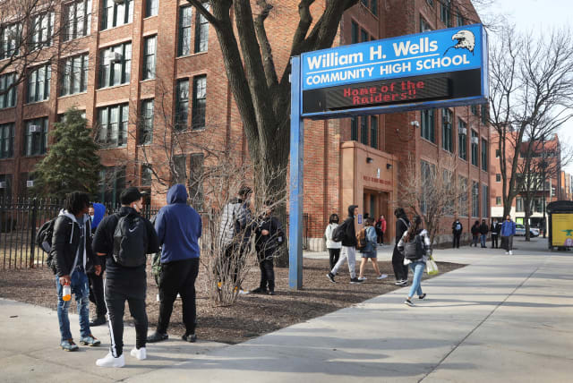  Students leave William Wells High School, part of Chicago Public Schools, March 14, 2022, in Chicago Illinois. CPS is the subject of a new federal Title VI discrimination investigation with the Department of Education. (photo credit: SCOTT OLSON/GETTY IMAGES/JTA)