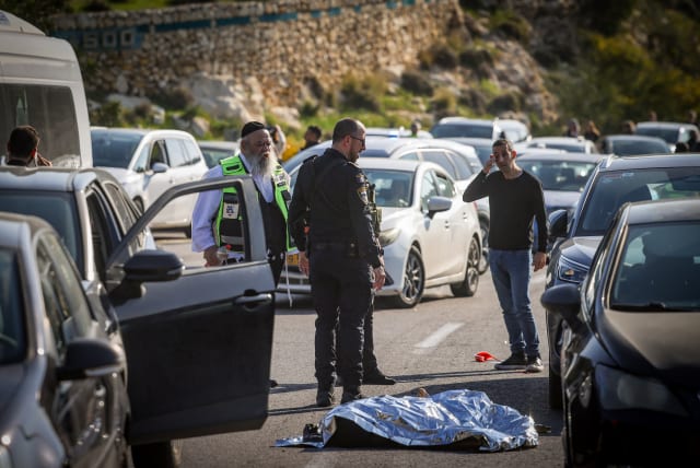  The scene of a shooting attack on Highway 1, near Ma'ale Adumin, on February 22, 2024 (photo credit: Chaim Goldberg/Flash90)
