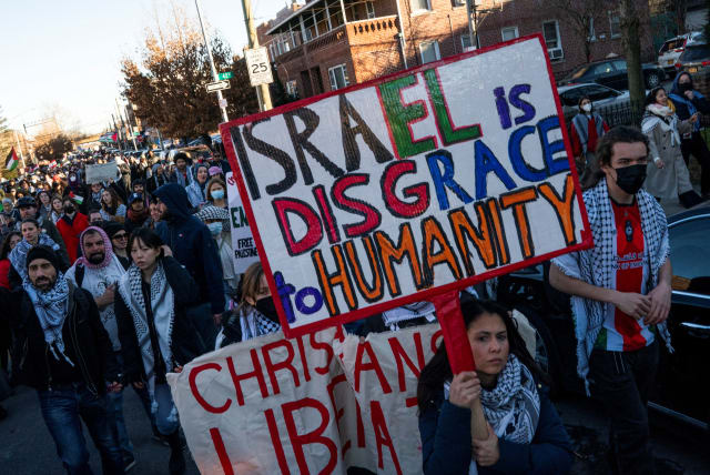  Pro-Palestinian demonstrators march after taking part in a rally demanding a ceasefire and the end of Israel attacks on Gaza at the borough of Queens in New York, U.S., February 19, 2024. (photo credit: REUTERS/EDUARDO MUNOZ)