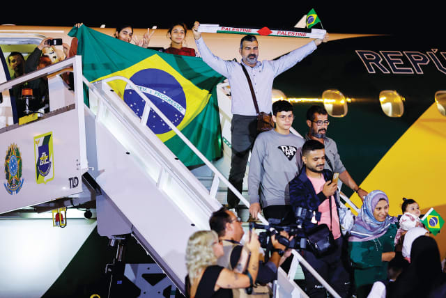  BRAZILIAN CITIZENS, who were repatriated from the Gaza Strip, deboard a flight as Brazil’s President Luiz Inácio Lula da Silva (not pictured) greets them upon arrival at the air force base of Brasilia in November. (photo credit: UESLEI MARCELINO/REUTERS)