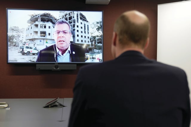  PRINCE WILLIAM listens to Pascal Hundt, senior crisis manager of the International Committee of the Red Cross, video calling from Gaza, during the prince’s visit to the British Red Cross at its headquarters in London last week. (photo credit: Kin Cheung/Reuters)