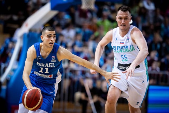  YAM MADAR (left) was a difference maker for Israel in both of its Eurobasket qualifiers over the weekend, scoring 16 points in the victory over Portugal and 19 points in the setback to Slovenia. (photo credit: FIBA/COURTESY)