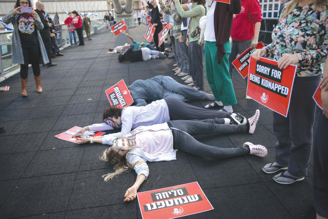  A PROTEST presentation in which hostages are portrayed as apologizing that they were kidnapped, and accusing that the government views their plight as a distraction and interference, is held at the Azrieli Mall in Tel Aviv, last week. (photo credit: MIRIAM ALSTER/FLASH90)