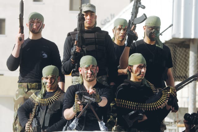  PALESTINIAN YOUTH participate in a Hamas summer camp, where they receive military as well as religious training, in Rafah, 2014. Hamas’s prime aim is the destruction of Israel as part of an apocalyptic vision, the writer notes.  (photo credit: ABED RAHIM KHATIB/FLASH90)