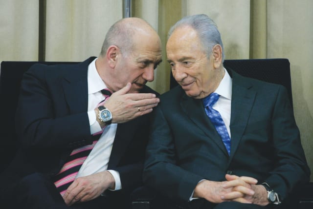  THEN-PRESIDENT Shimon Peres and then-prime minister Ehud Olmert attend a ceremony at the President’s Residence in Jerusalem, 2009. Peres and Olmert advocated for an agreement with the Palestinians and the Arab world, the writer notes. (photo credit: OLIVIER FITOUSSI/FLASH90)