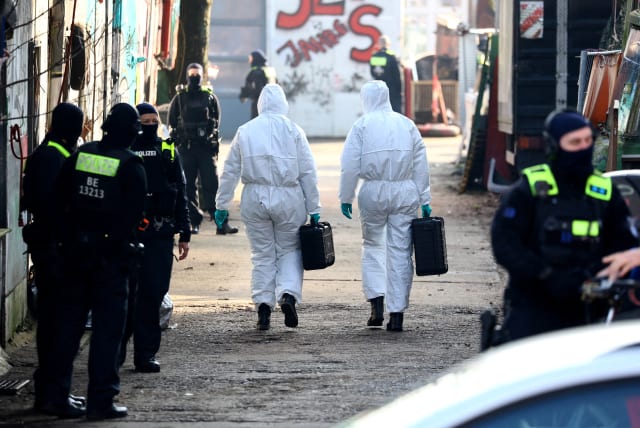 Forensic experts enter the area as special police searches for long-sought members Ernst Volker S. and Burkhard G. of Germany's notorious Red Army Faction (RAF) militant group, after decades on the run from armed robbery and attempted murder charges, in Berlin, Germany, March 3, 2024. (photo credit: Christian Mang/Reuters)