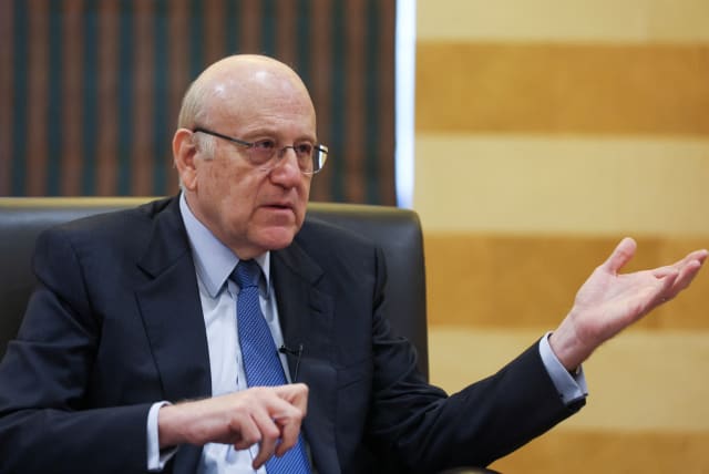  Lebanon's caretaker prime minister Najib Mikati gestures during an interview with Reuters at the government headquarters in downtown Beirut, Lebanon February 29, 2024. (photo credit: MOHAMED AZAKIR/REUTERS)