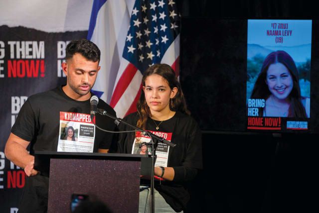  The siblings of Israeli hostage Na’ama Levy speak during a Lights for Liberty event demanding the release of the remaining hostages held in Gaza, in Manhattan on December 13, 2023.  (photo credit: David Dee Delgado/Reuters)