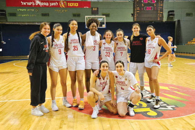  The red and white: On the court with Hapoel Lev Jerusalem basketball club. (photo credit: TAL MAROM)