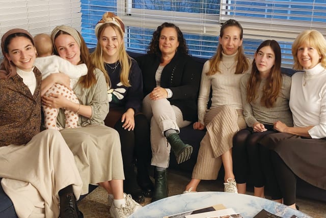  THE WOMEN who love Yosef (L-R): Charlie’s wife, Revital; Asher’s wife, Noor, with baby Ayala; Yosef’s wife, Senai; her mother, Norah Mazar; Yosef’s sisters Yael Ben Shimol and Elisheva; and their mother, Dina Guedalia. Not shown: sisters Shira Ephrat and Esther.  (photo credit: NATAN ROTHSTEIN)
