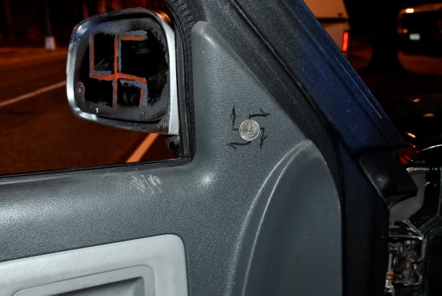  A photo released by the U.S. Capitol Police shows swastikas on the rear view mirror and inside a pickup truck driven by Donald Craighead, 44, of Oceanside, California at the time his arrest for possession of prohibited weapons near the Democratic National Committee headquarters on Capitol Hill in W (photo credit:  Capitol Police/Handout via REUTERS)