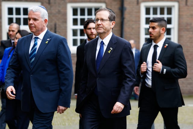  Israeli President Isaac Herzog walks near the Portuguese Synagogue on the day of the opening of the National Holocaust Museum, in Amsterdam, Netherlands, March 10, 2024. (photo credit: PIROSCHKA VAN DE WOUW/REUTERS)