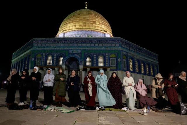 Muslim worshippers take part in the evening 'Tarawih' prayers during of the Muslim holy month of Ramadan, in front of the Dome of the Rock on the Temple Mount in Jerusalem’s Old City March 10, 2024. (photo credit: AMMAR AWAD/REUTERS)
