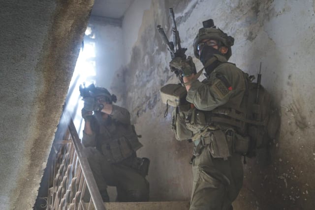  OLDIERS operate in the Gaza Strip this week. Israel may be isolated, but Israel will soldier on. It is the world that will suffer the greater loss, the writer asserts. (photo credit: IDF/Reuters)
