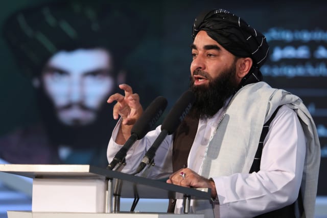  Afghan Taliban's Deputy Minister of Information and Culture and spokesman Zabihullah Mujahid speaks during the death anniversary of Mullah Mohammad Omar, the late leader and founder of the Taliban, in Kabul, Afghanistan, April 24, 2022. (photo credit: ALI KHARA/REUTERS)