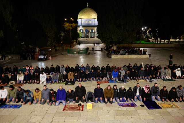  Muslim worshippers take part in the evening 'Tarawih' prayers during of the Muslim holy month of Ramadan, at Al-Aqsa compound, known to Jews as Temple Mount, in Jerusalem’s Old City March 10, 2024. (photo credit: AMMAR AWAD/REUTERS)