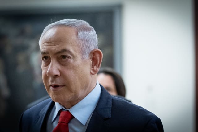  Israeli Prime Minister Benjamin Netanyahu walking outside his office at the Knesset, Israel's parliament in Jerusalem on March 13, 2024.  (photo credit: YONATAN SINDEL/FLASH90)